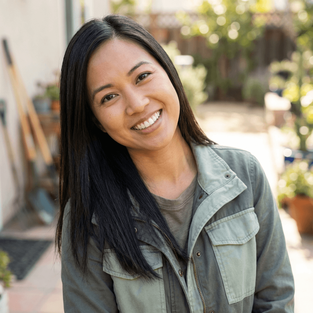 Olivia Chen smiling in a bright event venue