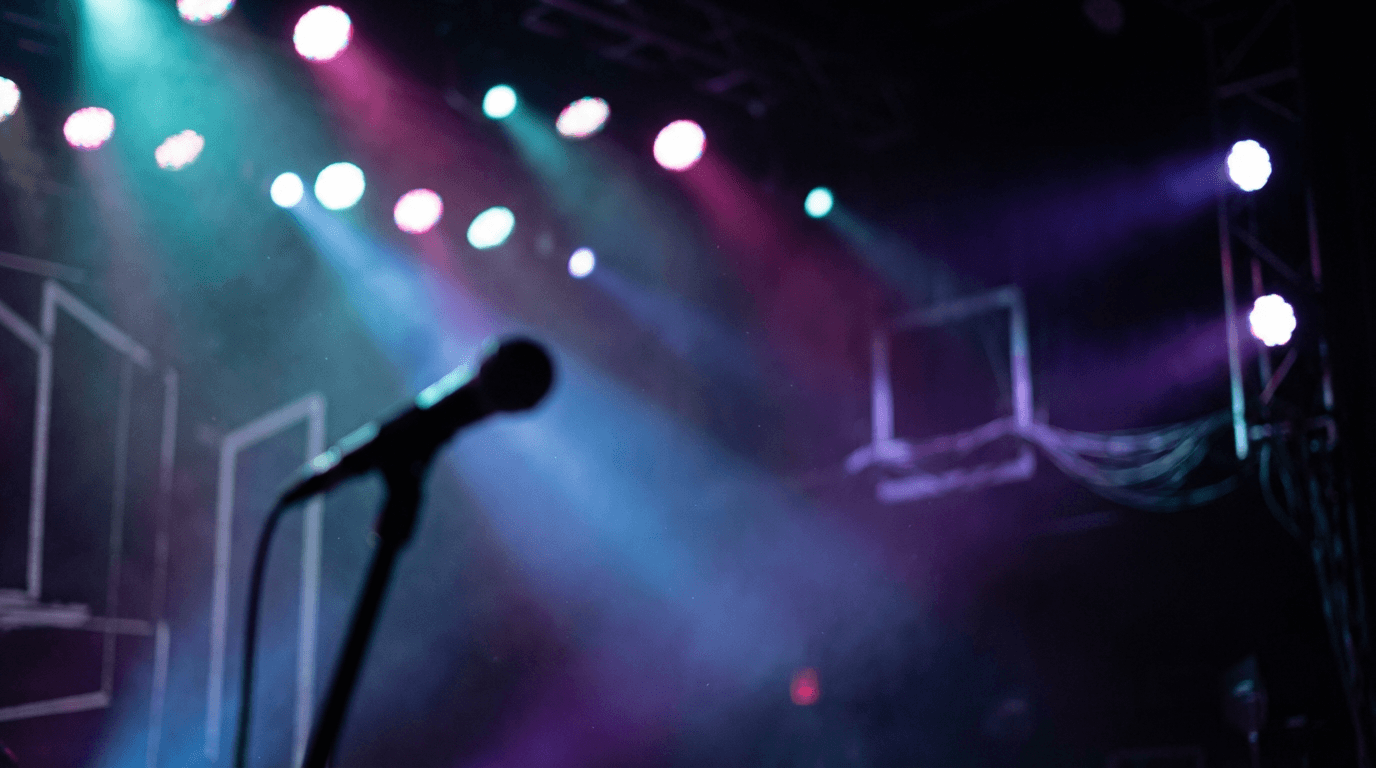 Warm stage lights glowing over an empty event space ready for a performance